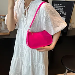 Hot pink patent leather shoulder bag detail, stylish underarm hobo purse for women daily commute.