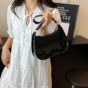 Black patent leather underarm shoulder bag for women, retro chic commuting handbag.