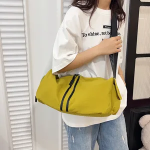 Large capacity casual canvas shoulder bag, minimalist cylindrical crossbody travel bag for daily use.