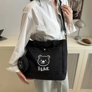 Black canvas tote bag with cute bear print, large capacity shoulder bag for women.