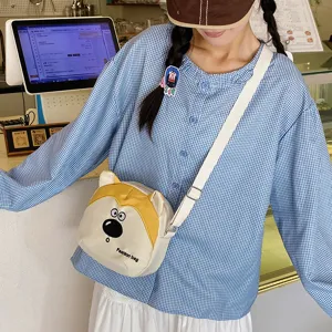 Cute cartoon dog canvas children crossbody bag, stylish kids shoulder bag for daily outdoor fun.