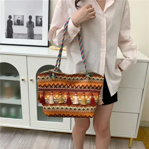 Ethnic style woven tote bag with colorful tassels, large capacity shoulder bag for women daily use.