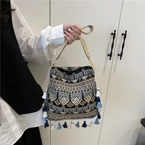 Boho ethnic style canvas shoulder bag with tassel details, vintage woven handbag for women.
