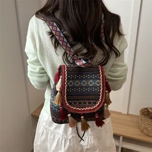 Ethnic style backpack with geometric pattern and tassel details, ideal for casual travel.