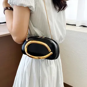Elegant black shoulder bag with gold hardware, minimalist chic crossbody chain handbag for women