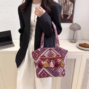 Ethnic style woven tote bag with colorful tassels, large capacity retro shoulder bag for women.