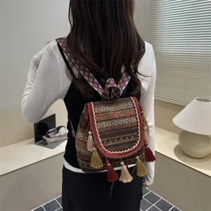 Ethnic style woven backpack with tassel and geometric print for women casual daily travel.