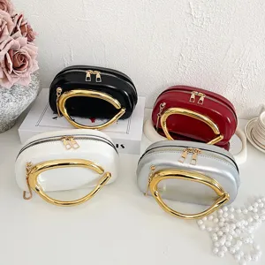 Stylish minimalist women's shoulder crossbody bag with unique metallic handle design.