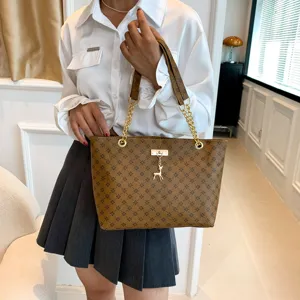 Stylish brown monogram tote bag with chain strap and cute deer charm for women.