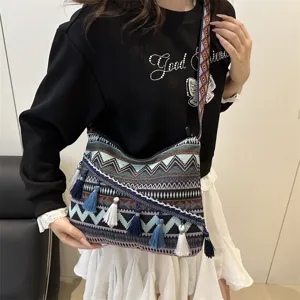 Bohemian ethnic style tassel shoulder bag for women, casual striped canvas crossbody tote.