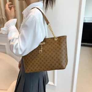 Stylish brown tote bag for women, retro clover print design with chain strap and cute deer charm.