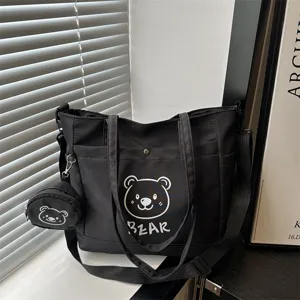 Black canvas tote bag with cute bear print, large capacity casual shoulder bag for daily women.