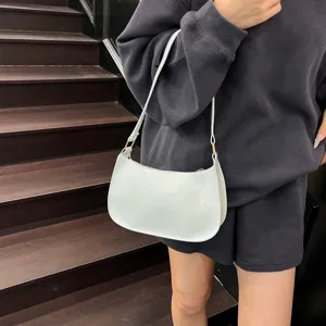 Stylish white patent leather underarm shoulder bag for women, chic and retro daily purse.