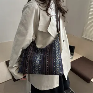 Ethnic style canvas shoulder bag detail view, casual crossbody bag with geometric pattern.