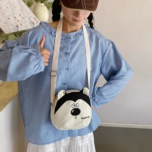 Cute cartoon dog canvas crossbody bag detail shot, showing playful animal ear design and strap.