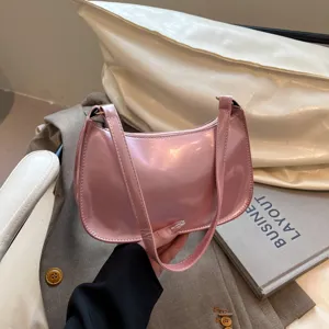 Pink shiny underarm bag for women, trendy vintage shoulder handbag for daily work commute.