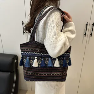 Ethnic style woven tote bag for women, large capacity shoulder bag with colorful tassels.