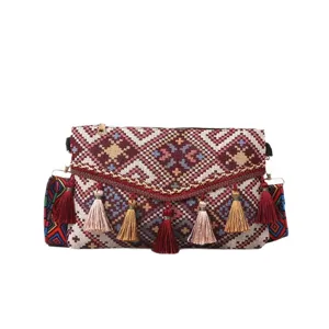 Ethnic style women woven crossbody shoulder bag with bohemian tassels and geometric patterns.