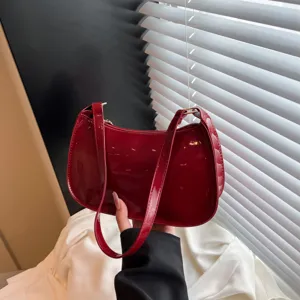 Glossy red patent leather shoulder bag stylish vintage underarm hobo bag for women commute.