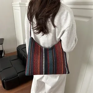 Woven shoulder bag with ethnic geometric vertical stripe pattern and casual daily style detail