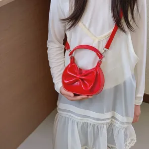 Red cute bow children handbag mini crossbody bag fine detail showcase sweet accessory style.