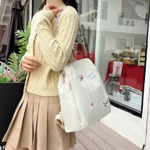 Women daily casual white backpack with floral embroidery and large capacity stylish design.