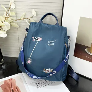 Blue casual travel backpack with floral embroidery, large capacity daily commuter school bag.