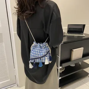 Woven fringe bucket bag for women, blue and white tweed shoulder crossbody bag with tassels.