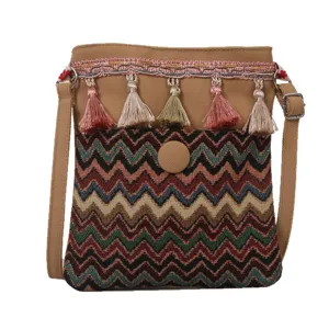 Ethnic style canvas crossbody bag with colorful tassels and wave patterns for travel.