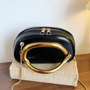 Black PU leather women shoulder bag with luxury irregular gold metal handle and chain strap.
