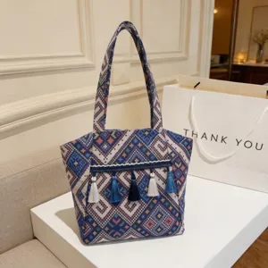 Vintage ethnic style woven tote bag with tassels, large capacity casual shoulder handbag for women.