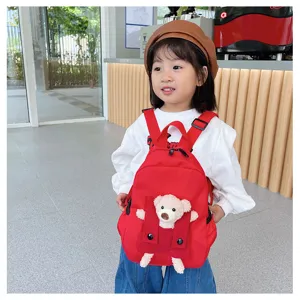Cute cartoon bear doll kids backpack, red casual school bag for boys and girls travel.