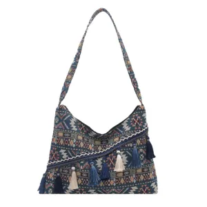 Bolso de hombro tejido estilo étnico bolso cruzado bohemio con borlas elegantes y patrones coloridos.