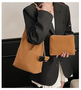 Close-up of retro suede texture shoulder tote bag with matching pouch, elegant commuting style.