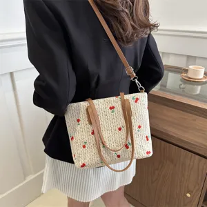 Summer straw tote bag with red embroidery, large capacity shoulder handbag for travel commute.