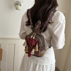 Ethnic style mini backpack for women, casual tassel backpack with colorful woven straps.