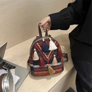 Ethnic style woven mini backpack detail, colorful tassels, casual versatile daily bag.