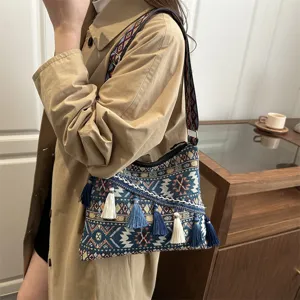 Ethnic style woven crossbody bag for women, retro shoulder bag with bohemian tassels.