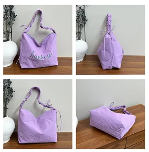 Purple nylon shoulder bag detail, casual hobo tote with gathered handles and drawstring.