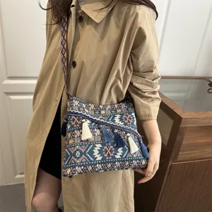 Ethnic style woven crossbody bag with vintage geometric patterns and cute tassels for women.