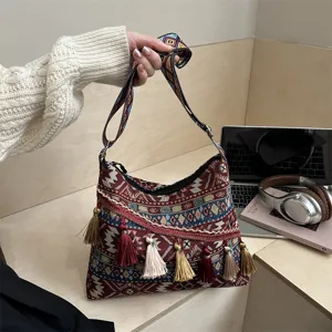 Ethnic style woven shoulder bag for women, vintage crossbody handbag with colorful tassels.
