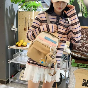 Cute canvas backpack for kids and teens with cute bear pendant and colorful straps stylish.
