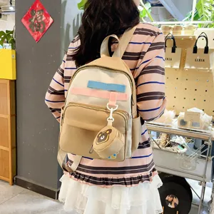 Cute cartoon children school backpack with bear pendant, lightweight and large capacity.