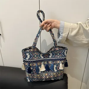 Ethnic style embroidered tote bag with blue and white tassels, stylish daily shoulder bag.