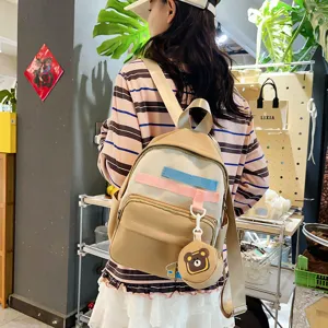 Cute casual canvas backpack for kids and students with multi-compartments and lovely bear pendant.