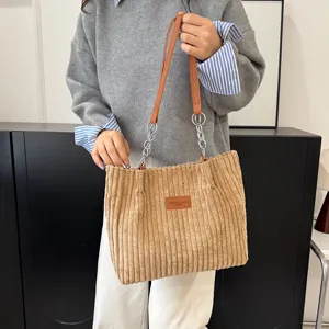 Corduroy chain tote bag detail, women winter fashion shoulder bag, large capacity commute bag.
