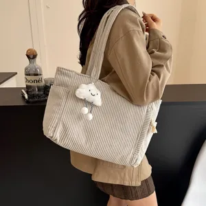 Corduroy tote bag for women, large capacity shoulder bag with cute cloud pendant for daily use.