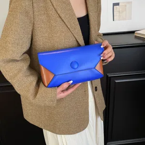 Elegant color-blocked envelope clutch bag for women, stylish evening party handbag.