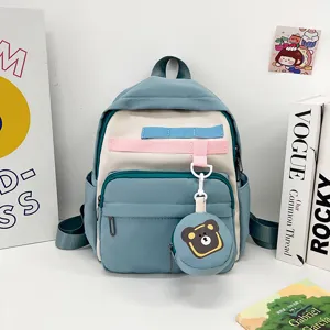 Cute cartoon children backpack with bear pendant, large capacity casual school bag for kids.