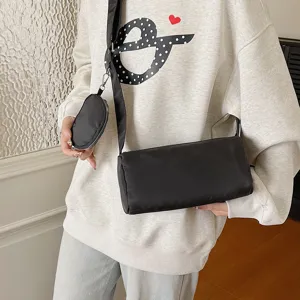 Detailed view of casual black nylon shoulder bag with small pouch for women daily wear style